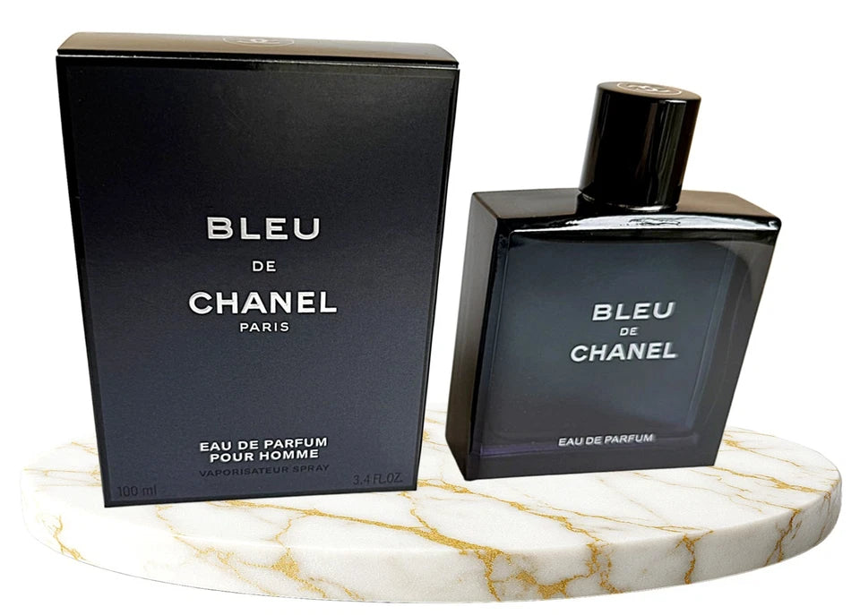 Chanel Bleu perfume bottle and packaging on a marble surface